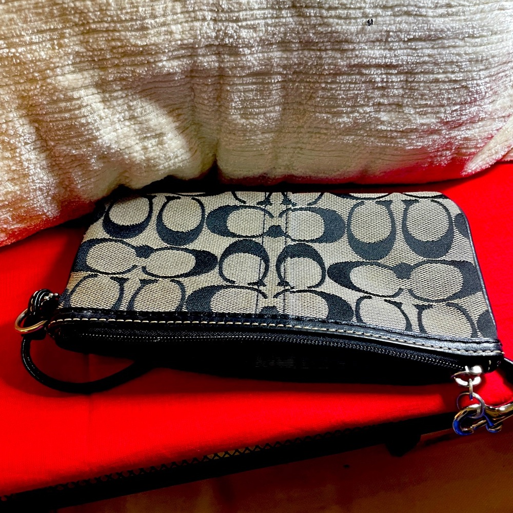 Coach small black and white wristlet bag